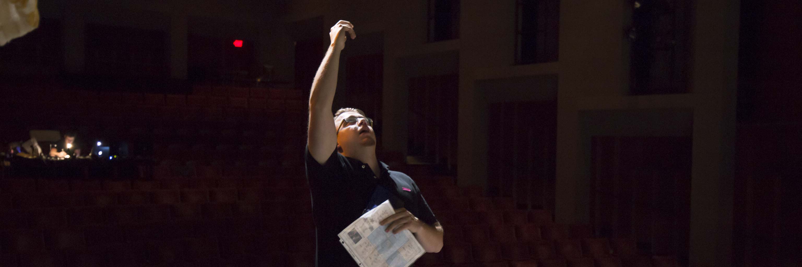 lighting director looking at lights
