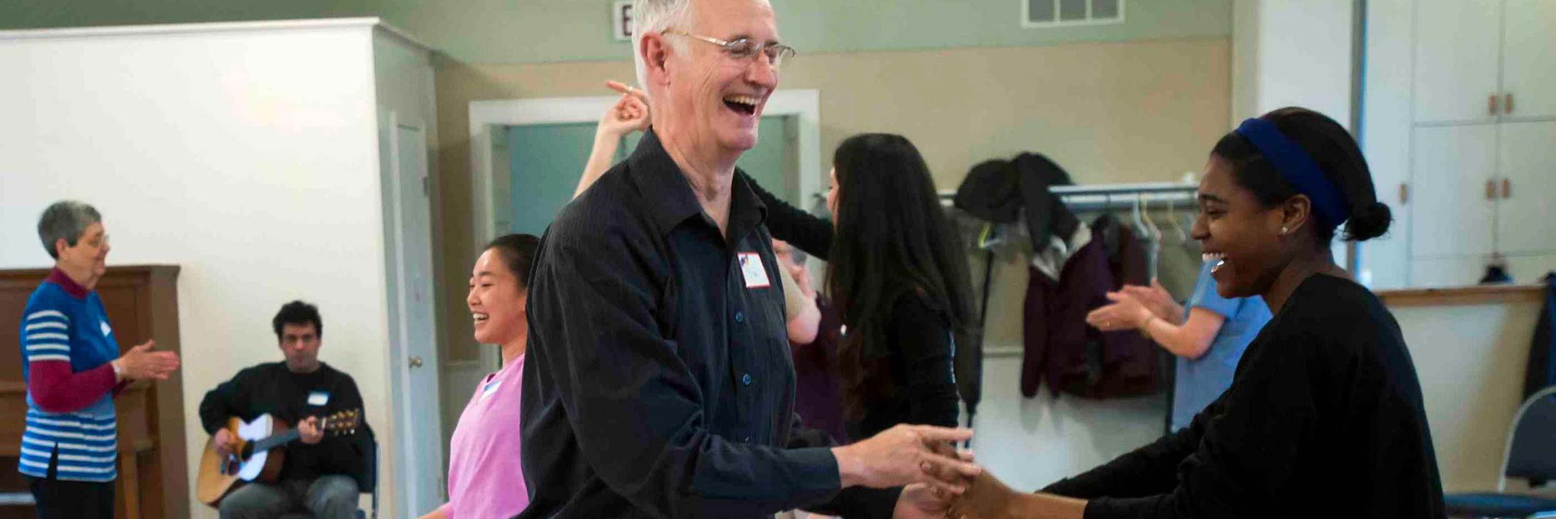 Man with parkinsons and students