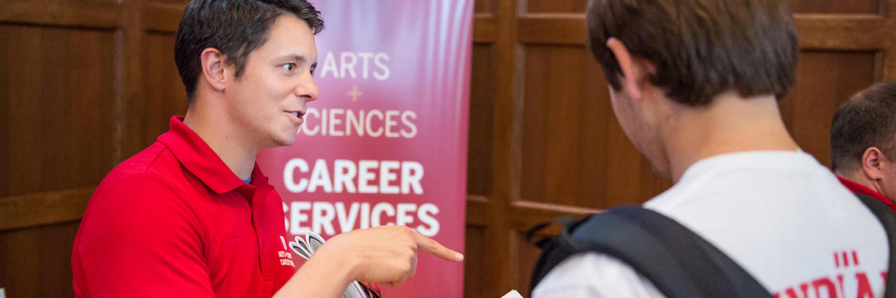 Walter center talking with student