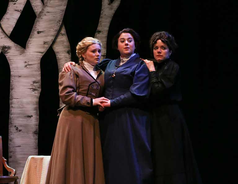 Three actresses on stage