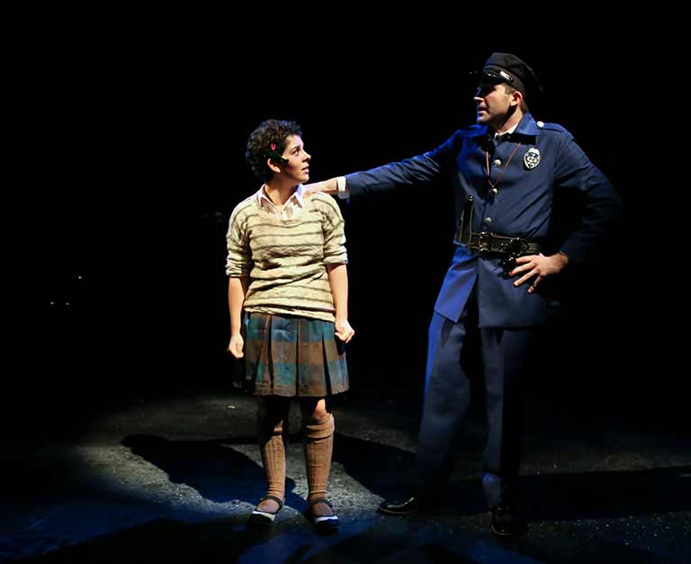 Policeman talking to girl